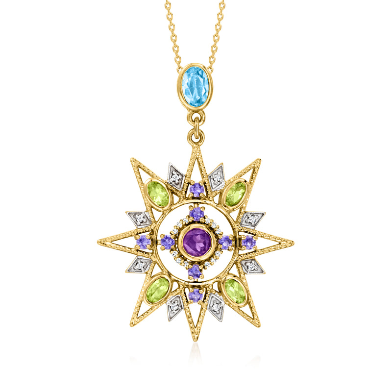 Gold-tone starburst pendant necklace with purple center gemstone, green accents, and blue teardrop