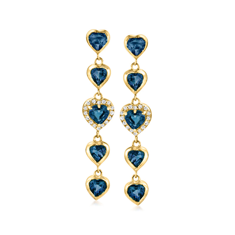 Gold drop earrings with three blue heart-shaped sapphires and diamond accents, dangling design