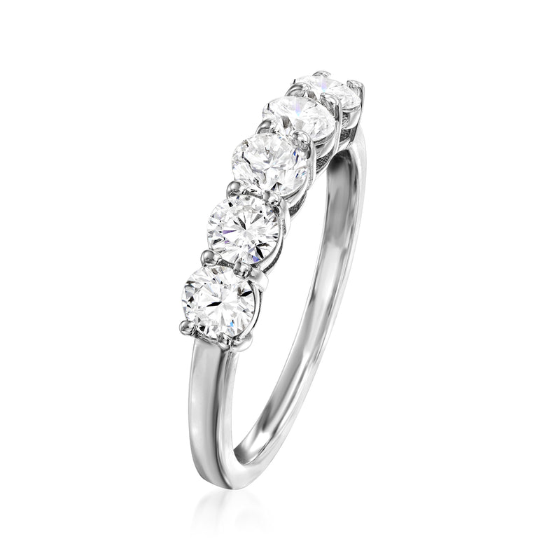Side view of five-stone round diamond ring with prong settings on white gold band