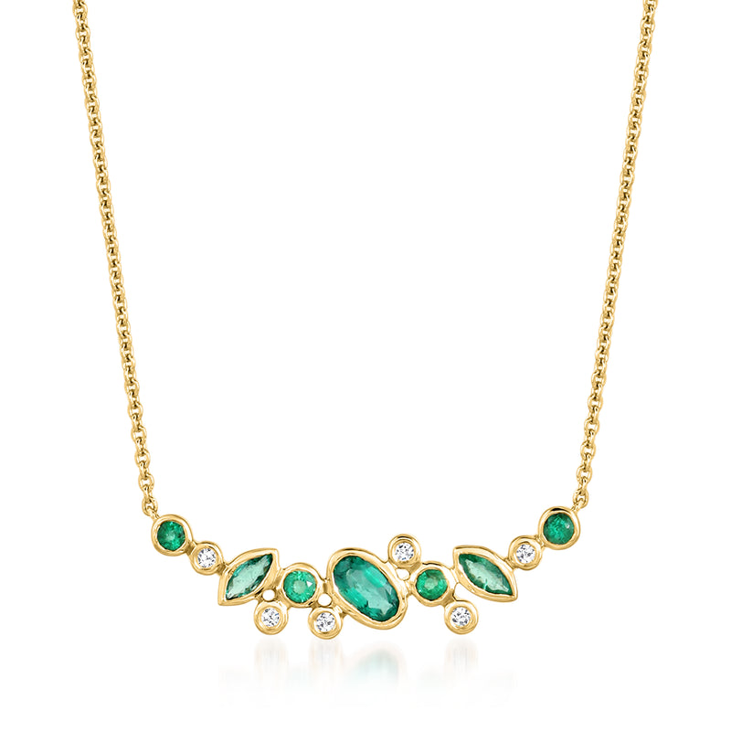 14kt yellow gold necklace with scattered emerald-green stones and small round diamonds