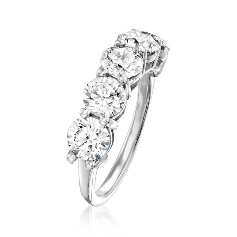 Five-stone diamond ring, angled view: five round prong-set stones on white gold band