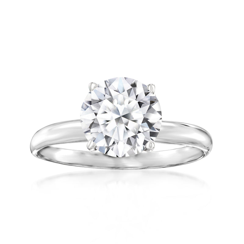 Round diamond solitaire ring with four prong setting on polished white gold band