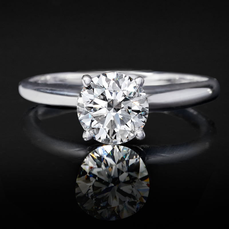 Close-up of round lab-grown diamond solitaire ring in 14kt white gold, four prongs