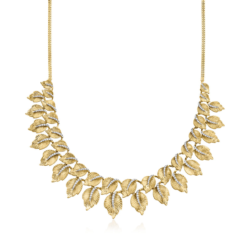 Gold leaf collar necklace with linked leaf motif along the neckline