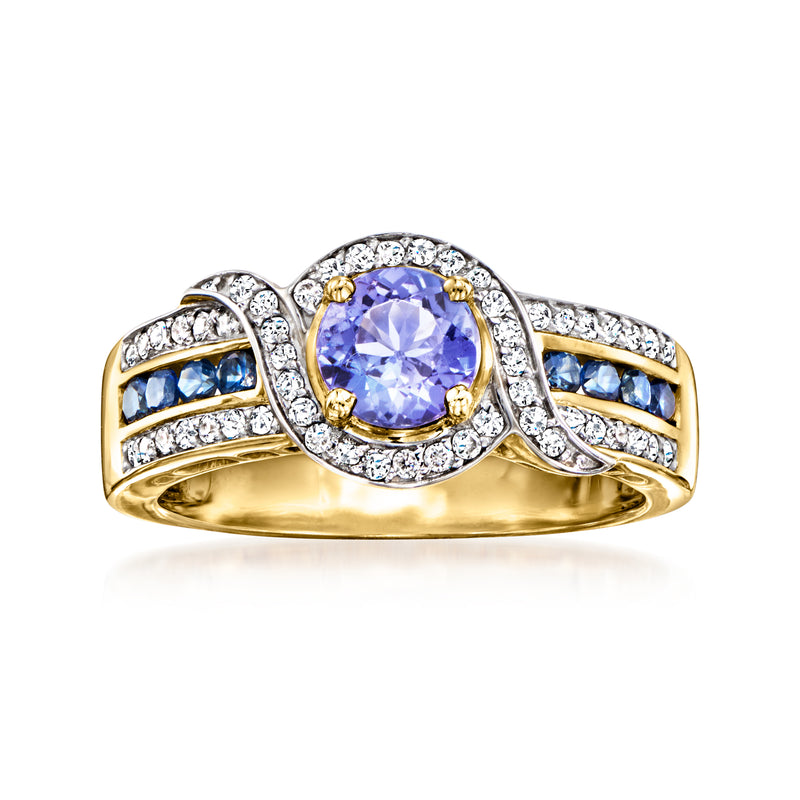 14kt yellow gold ring with oval tanzanite center, diamond halo, blue sapphire accents