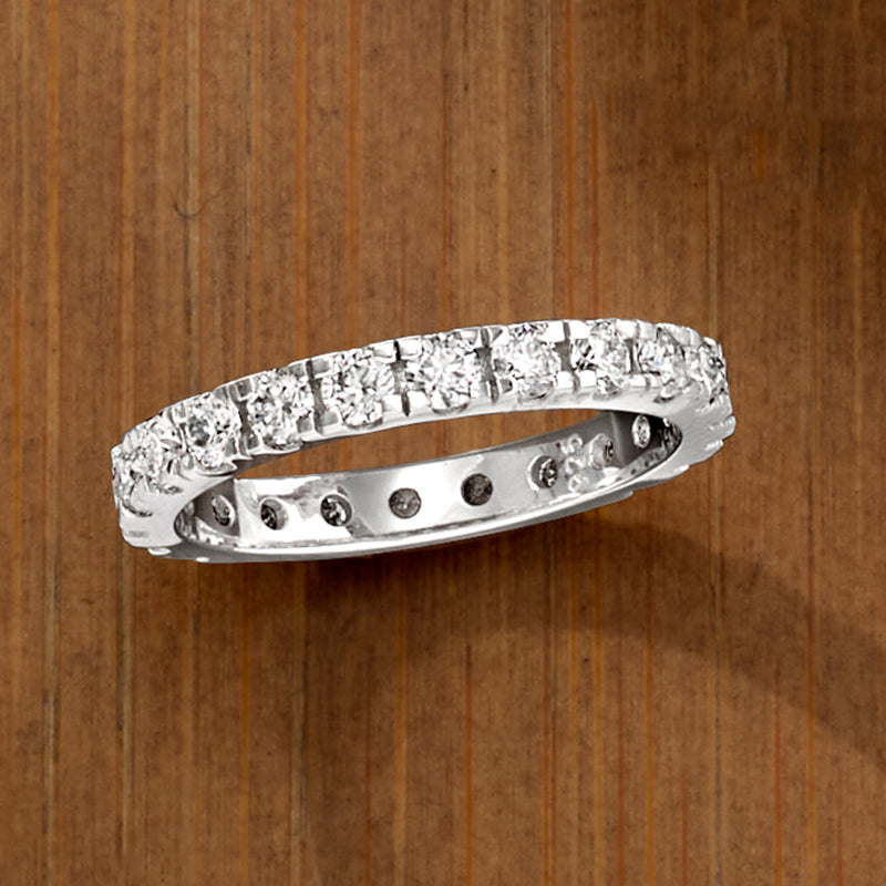 Sterling silver eternity band profile view with round moissanite stones