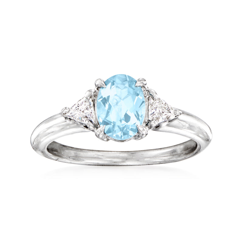 Vintage platinum ring with oval aquamarine center and diamond side accents