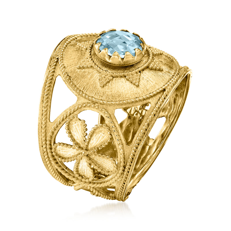 Gold Etruscan-style ring with oval sky-blue stone and side floral filigree