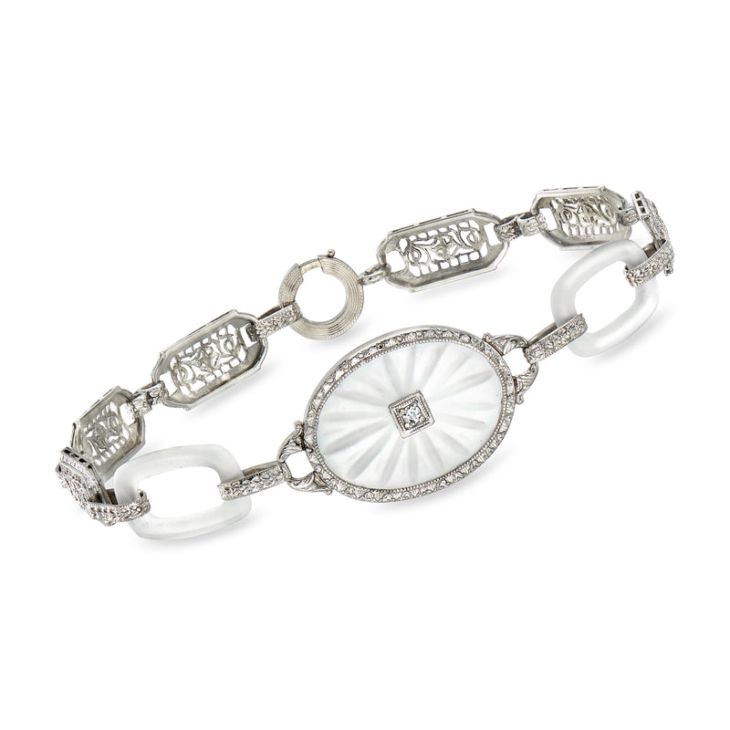 Vintage white gold filigree bracelet with oval bezel and single diamond centerpiece