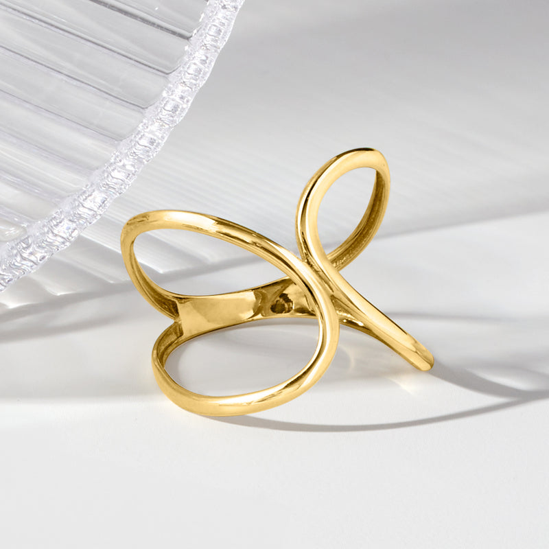 Yellow gold abstract geometric ring with overlapping oval loops and open center