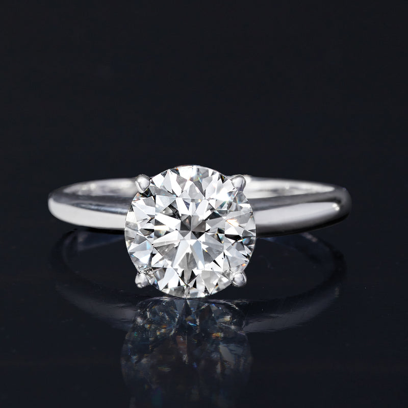 Platinum solitaire ring featuring a round brilliant diamond center