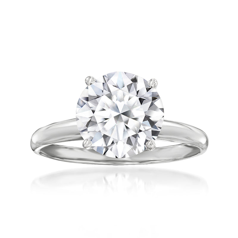 Platinum solitaire ring with round brilliant lab-grown diamond, four-prong setting.