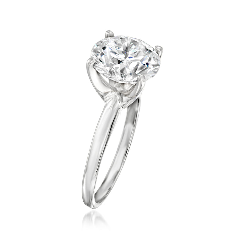 Platinum solitaire ring with round lab-grown diamond, side view showing slender band