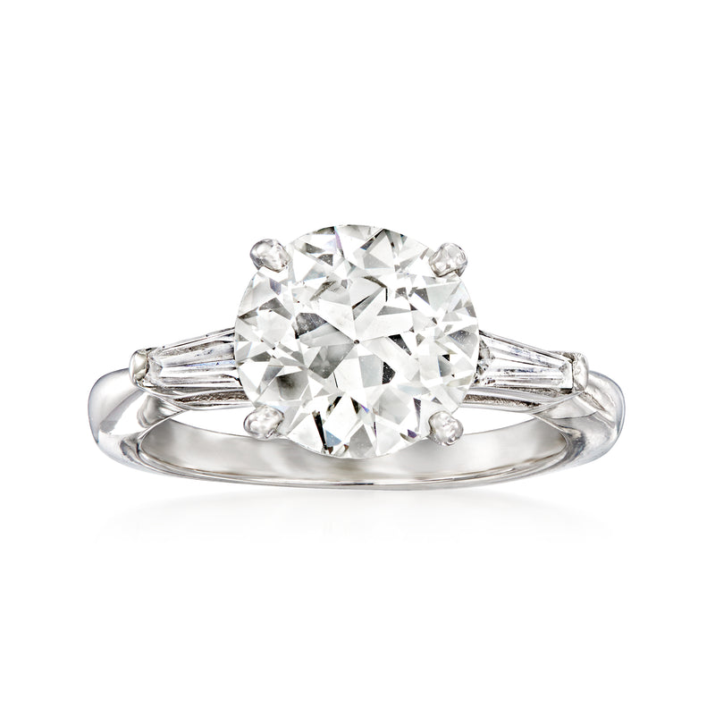 Platinum vintage diamond ring with large round center stone and baguette side diamonds
