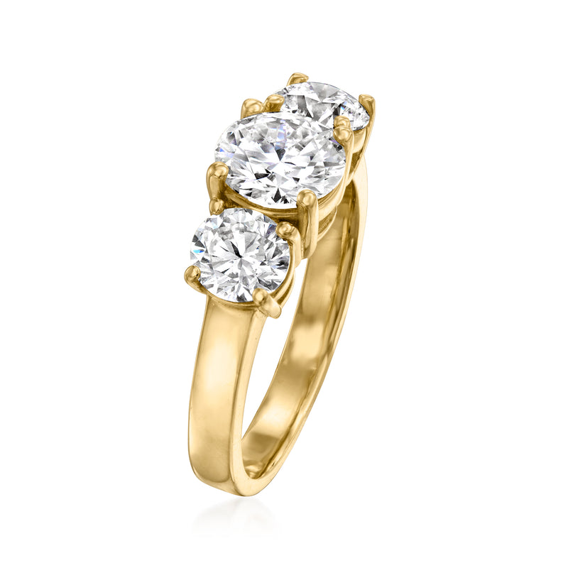 Three-stone diamond ring in 14kt yellow gold, side view with three round diamonds