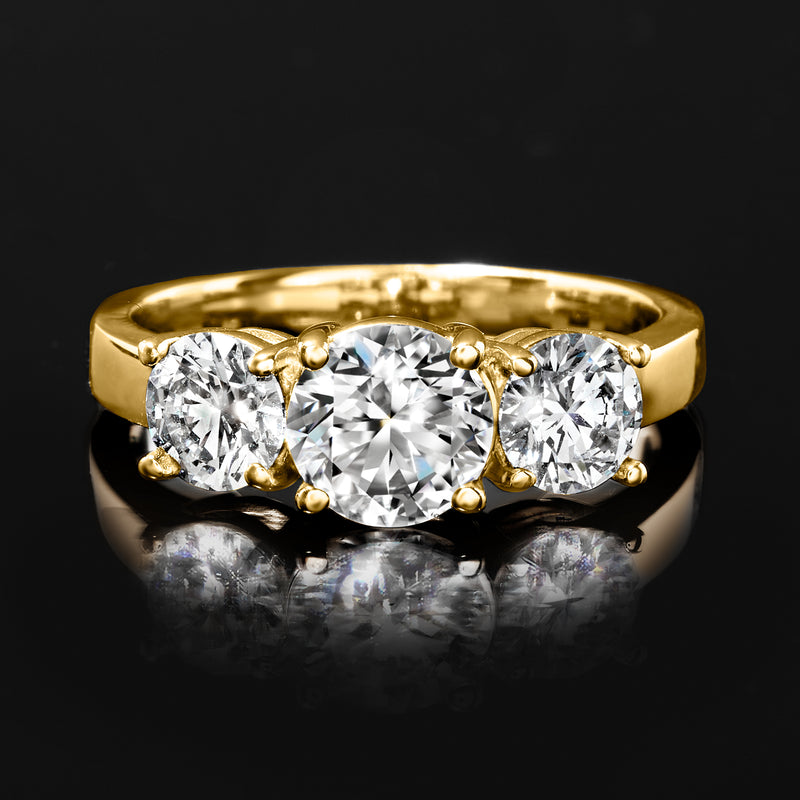 Three-stone diamond ring in 14kt yellow gold, centered round diamond with two side stones