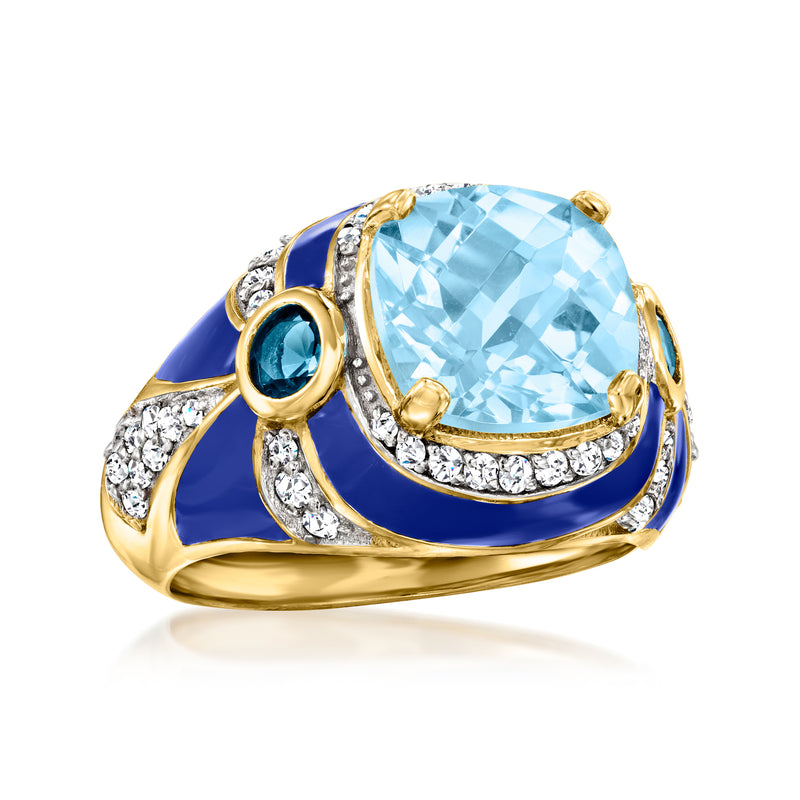 Gold-tone ring angled view with light-blue gemstone, blue enamel swoosh, and white crystals
