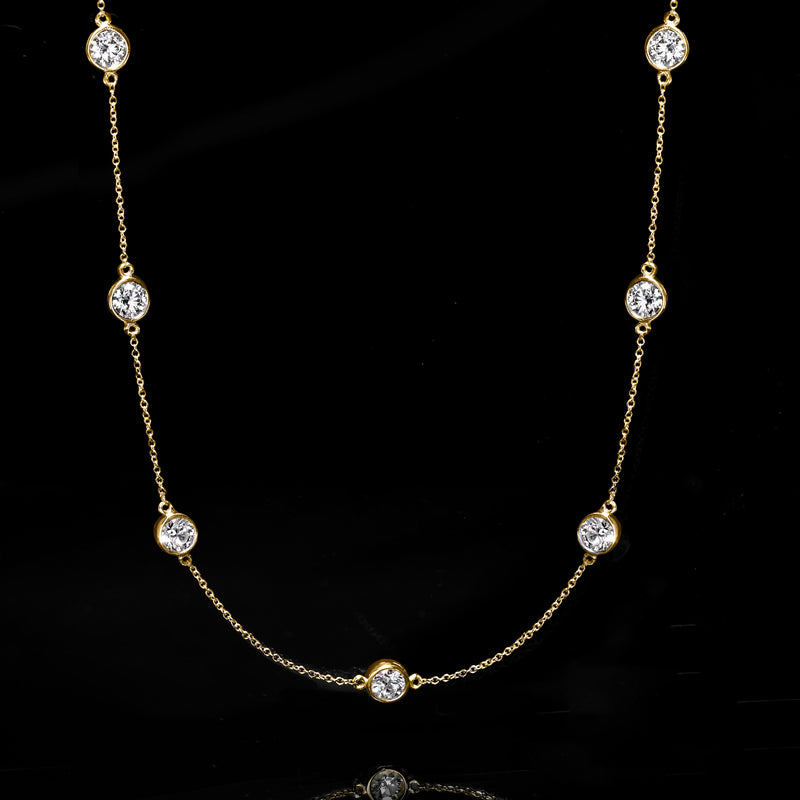14kt yellow gold station necklace with round diamond-like stones