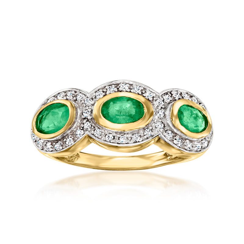 Ring with three oval emerald-green stones, gold bezels and white zircon halo accents
