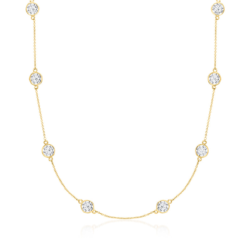 Yellow gold diamond station necklace with round stones on a delicate chain