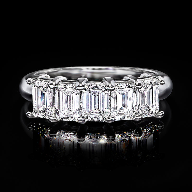 White gold five-stone diamond ring with baguette-cut rectangular stones, frontal view