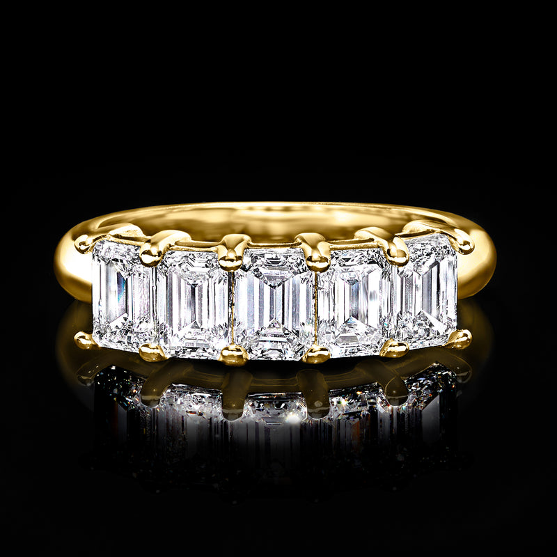 Five-stone diamond ring in 14kt yellow gold with five emerald-cut diamonds