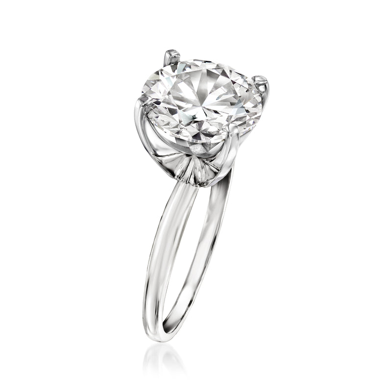 14kt white gold solitaire ring with large round diamond and visible prongs