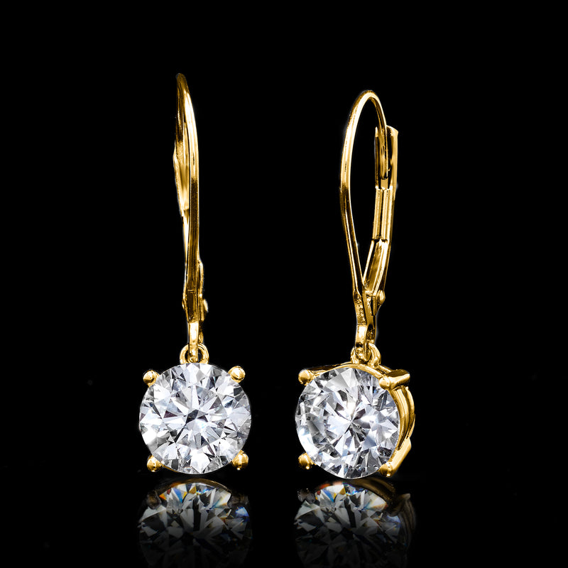 Yellow gold leverback drop earrings with large round diamond settings, angled view