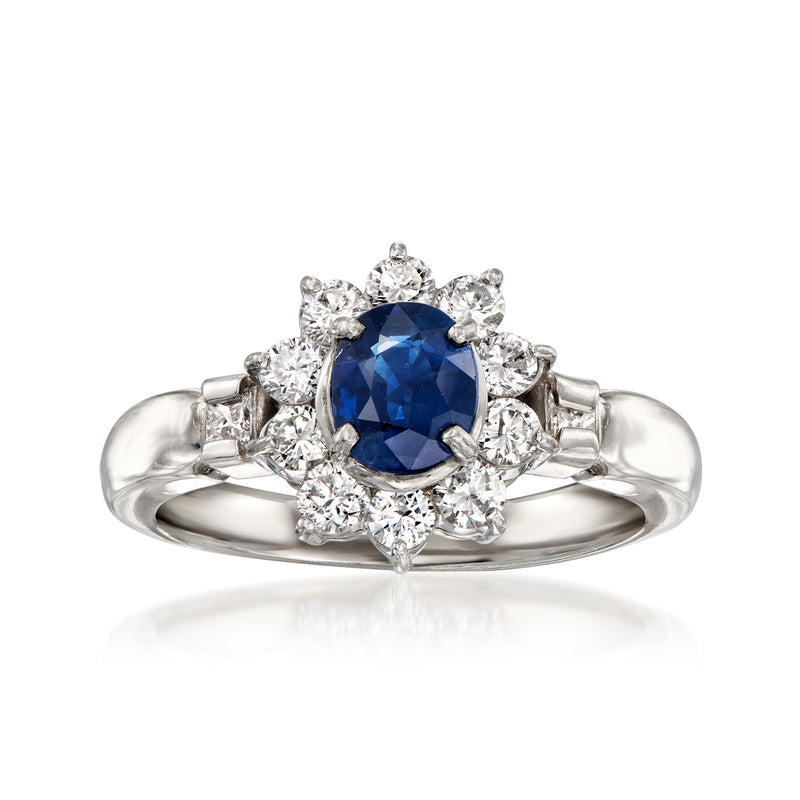 Vintage platinum ring with oval blue sapphire center and diamond halo