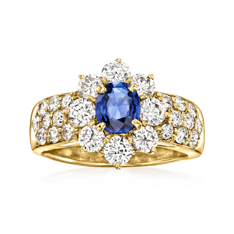 Vintage 18k yellow gold ring with oval blue sapphire center and diamond cluster