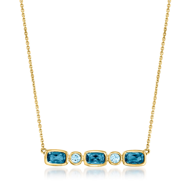 14kt yellow gold necklace with oval blue topaz and round diamond accents