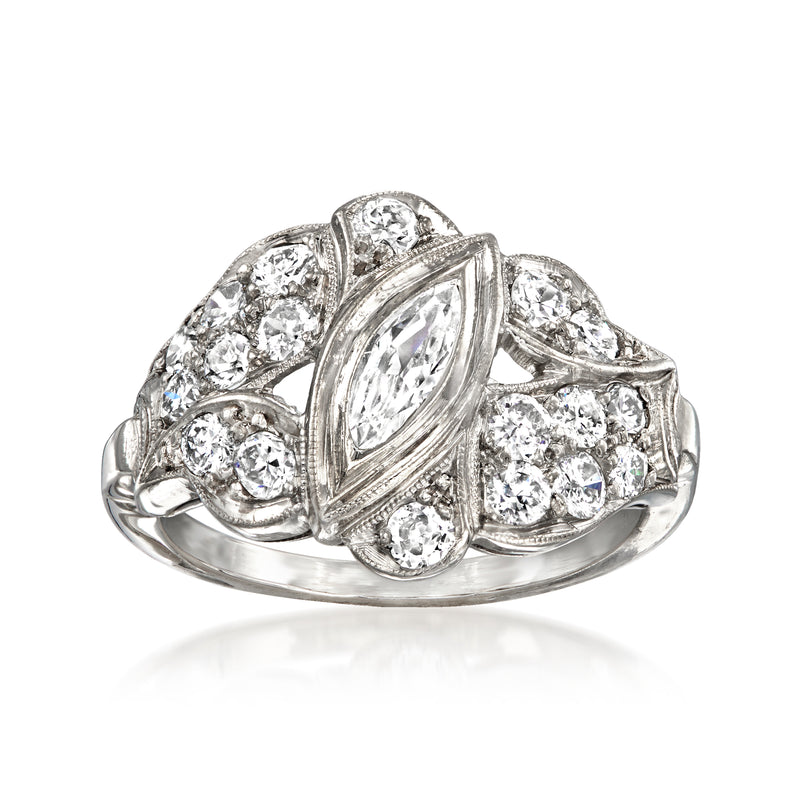Platinum vintage diamond ring with marquise center and round bezel-set stones