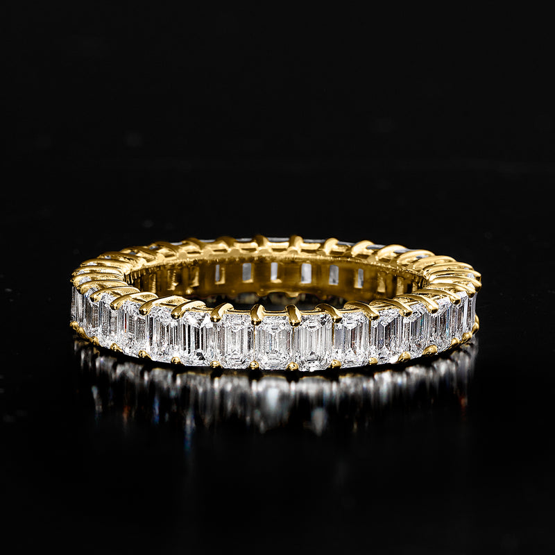 14kt yellow gold eternity band with emerald-cut lab-grown diamonds, top angle