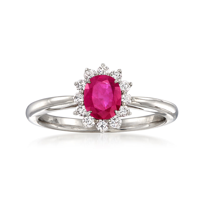 Platinum ring with oval ruby center and diamond halo, split prong band