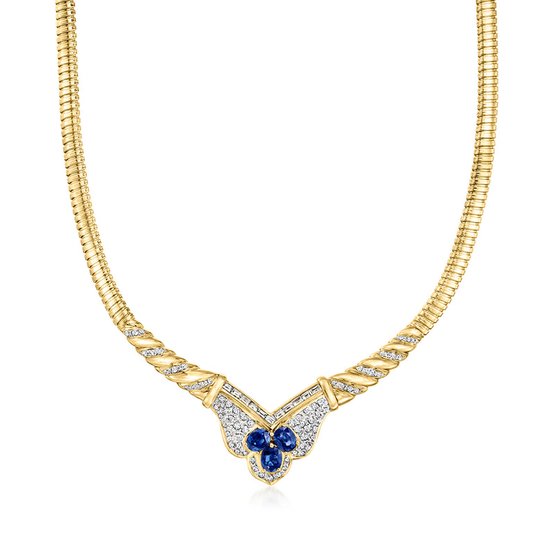 Yellow and two-tone gold necklace with fancy-link chain and blue sapphire cluster center