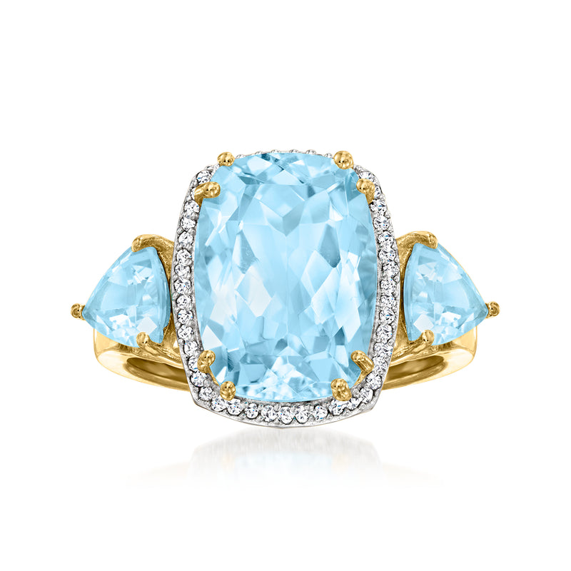 Sky blue topaz and diamond halo ring in 18kt gold over sterling, oval center