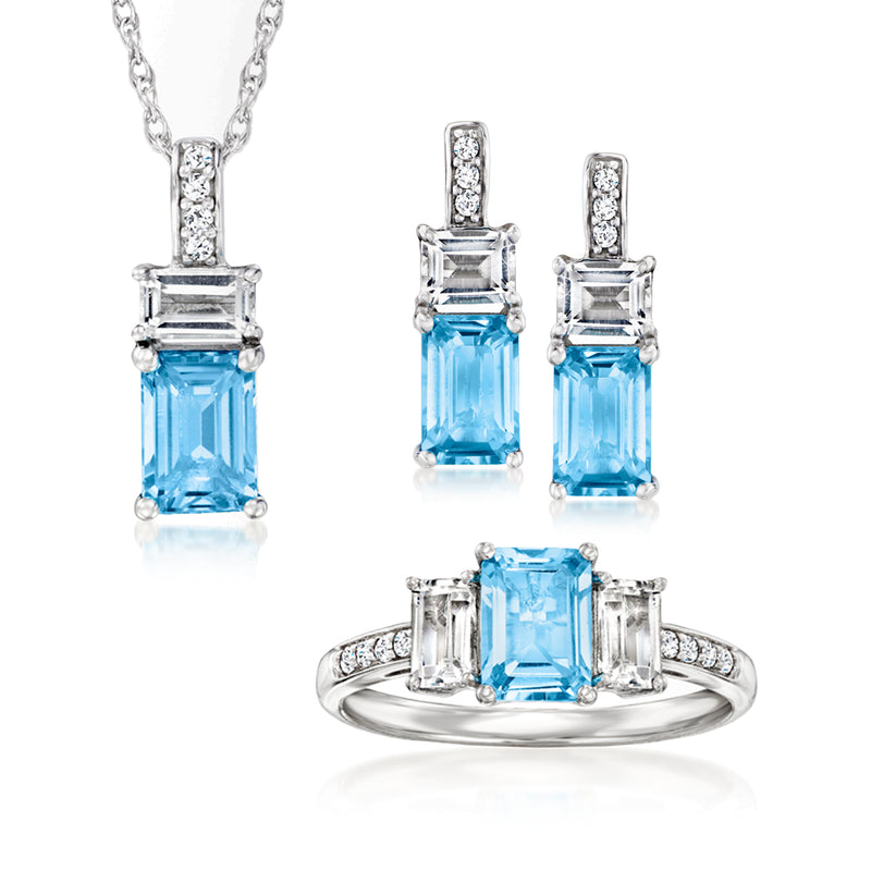 Sterling silver jewelry set with blue and white topaz-style stones; pendant, ring, earrings