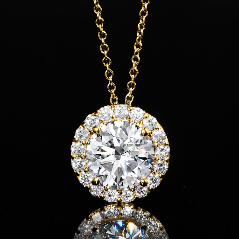 Yellow gold round diamond halo pendant with prong-set center and sparkle