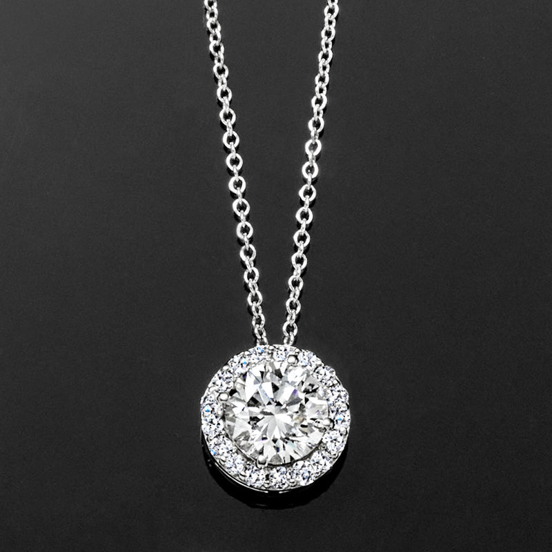 White gold round halo diamond pendant necklace, close view of pendant on chain