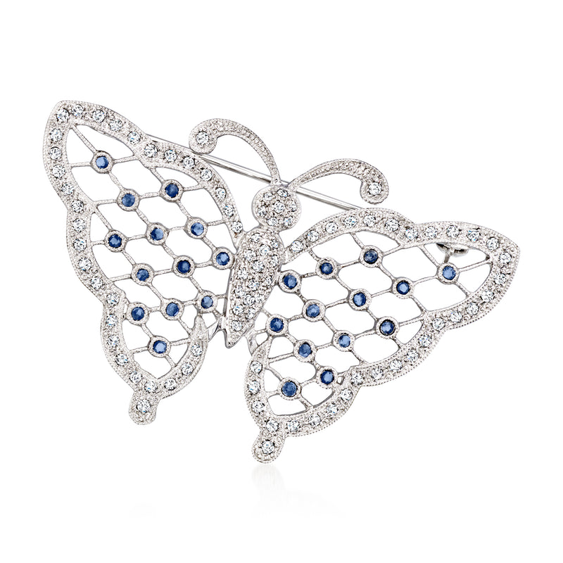 Diamond and sapphire butterfly pin in 14kt white gold with ornate openwork design