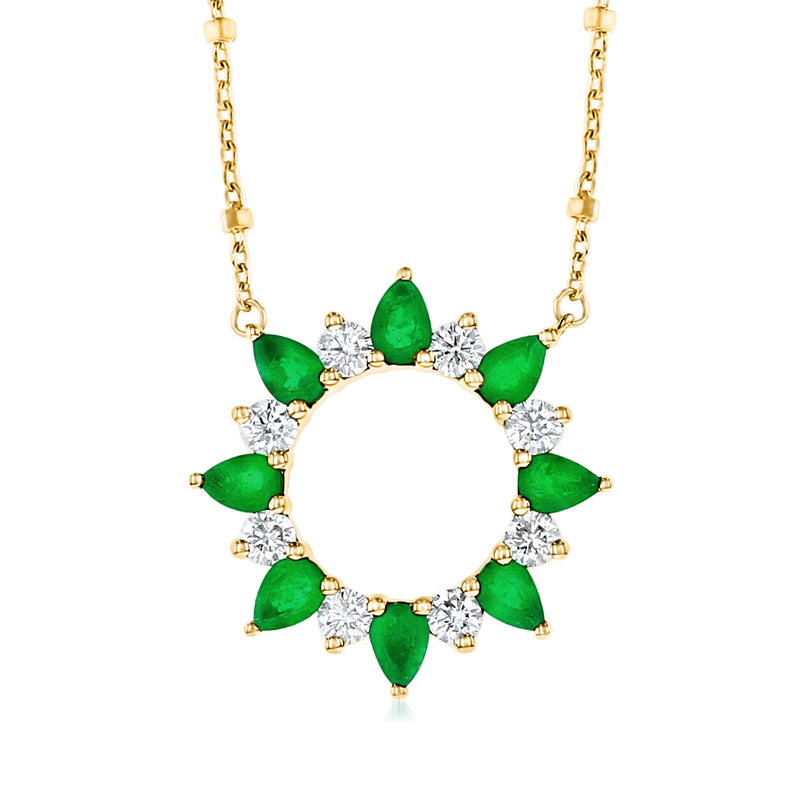 Gold sun necklace with green emerald teardrop stones and small diamond accents, pendant