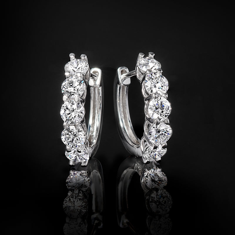 White gold five-stone hoop earrings with lab-grown diamonds prong-set along the hoop