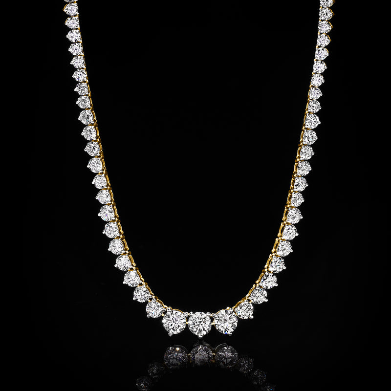 Graduated round diamond tennis necklace in 14kt yellow gold with center diamond cluster.