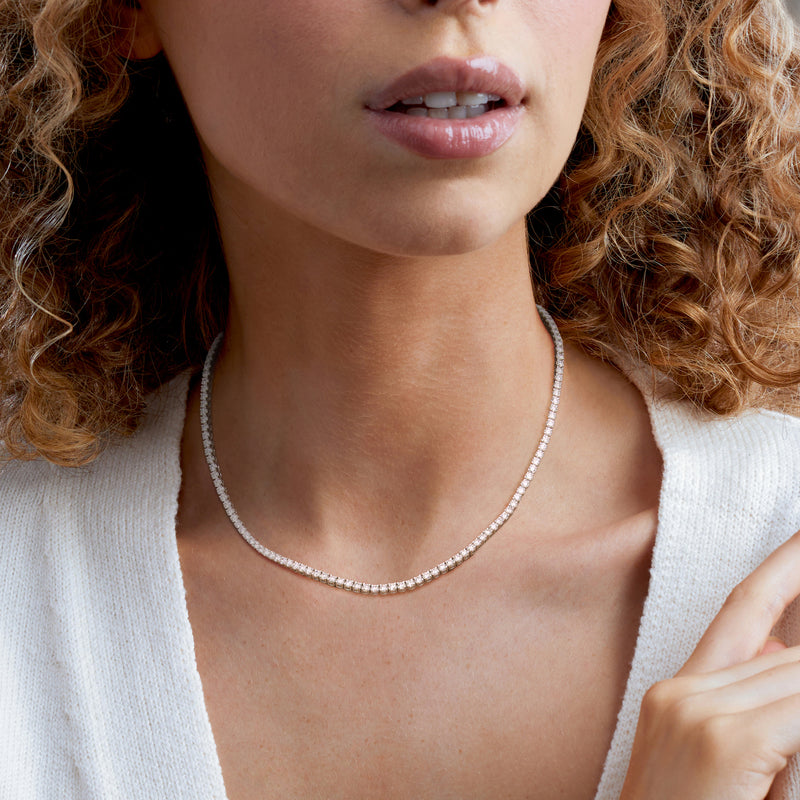 Lab-grown diamond tennis necklace in 14kt white gold on model’s neckline