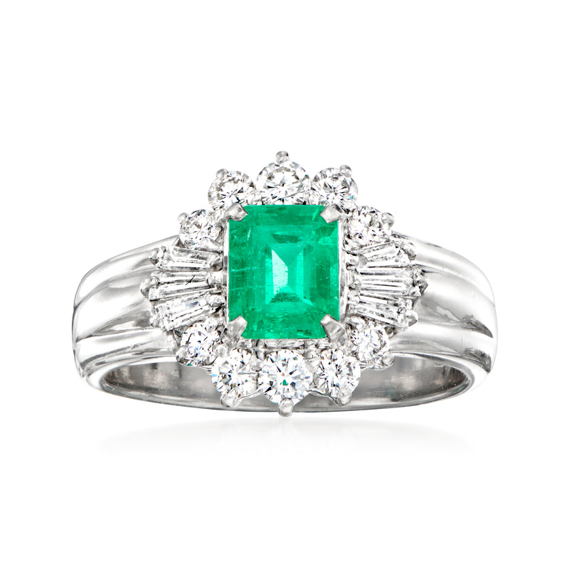 Platinum vintage ring with green emerald-cut center stone and diamond halo