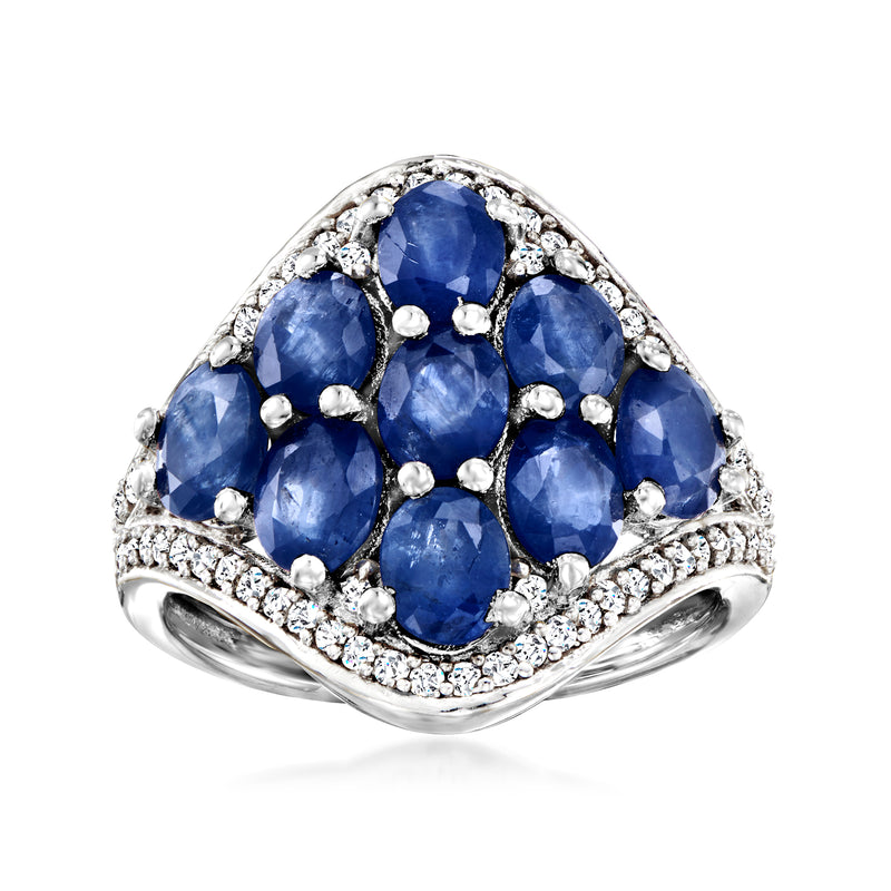 Sterling silver ring with oval blue sapphire cluster and round diamond accents