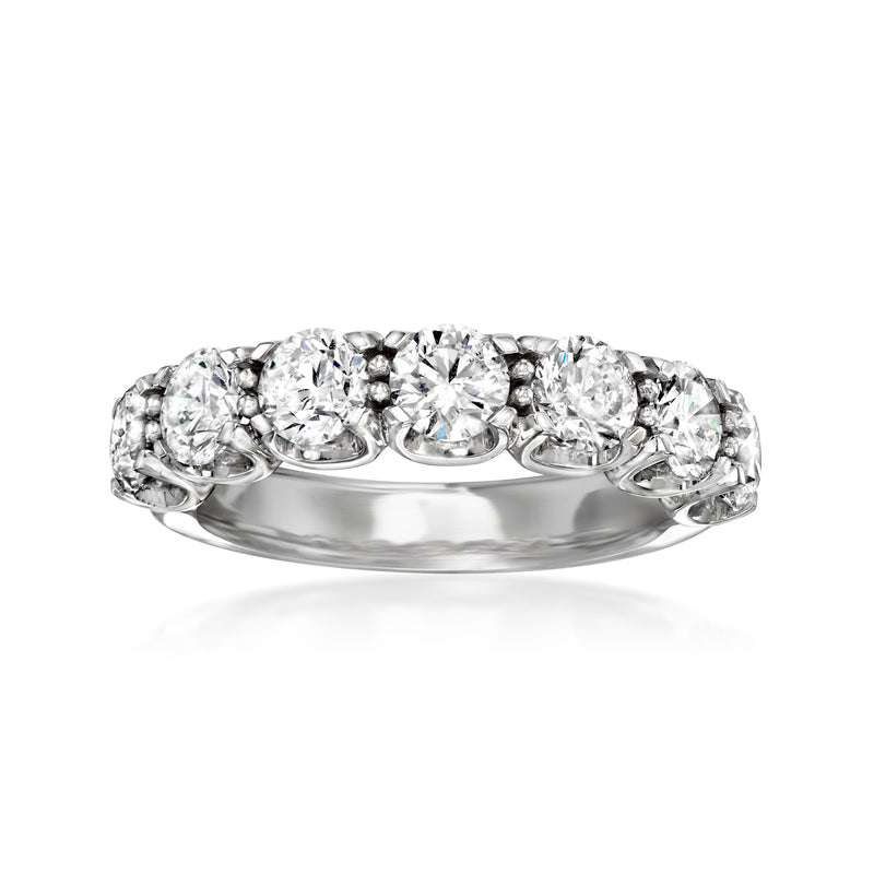 Diamond wedding band in 14kt white gold with round prong-set stones, curved profile