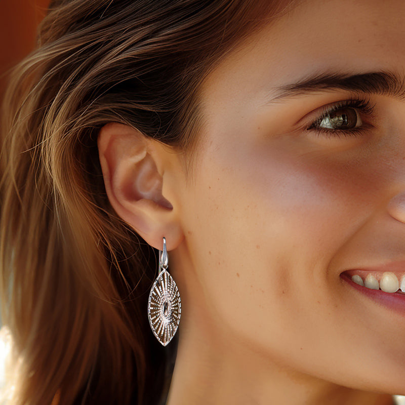 Sterling silver navette drop earrings with diamond-cut openwork panels on earwire
