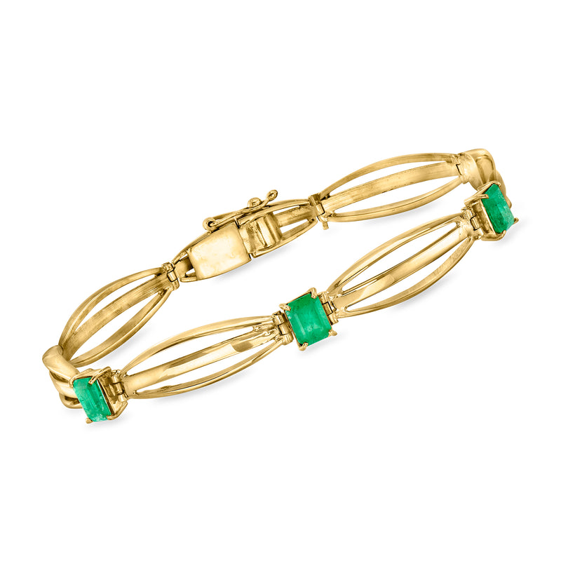 18kt yellow gold fancy-link bracelet with emerald-cut green gemstones, hinged clasp