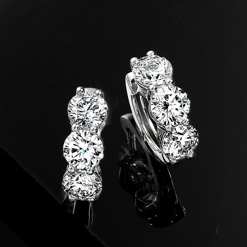 14kt white gold huggie hoop earrings, three-stone diamond cluster, side view